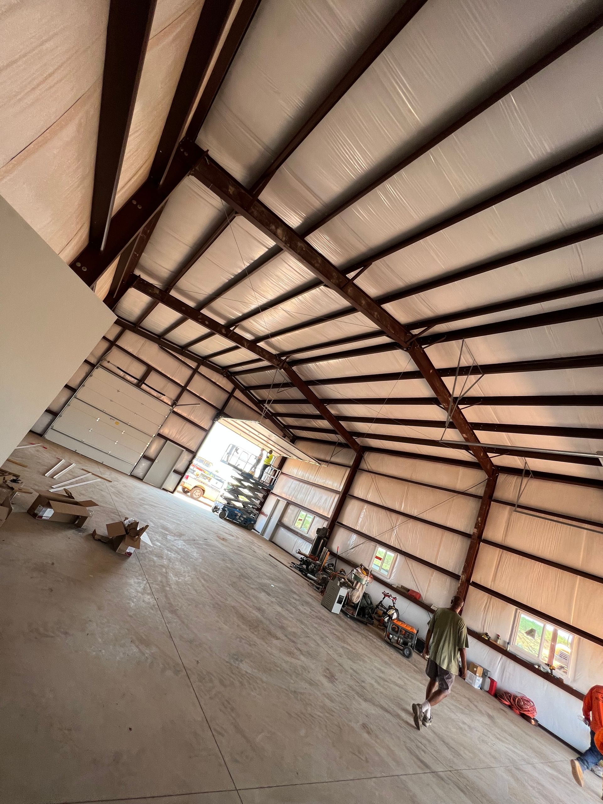 A large warehouse with a lot of metal beams