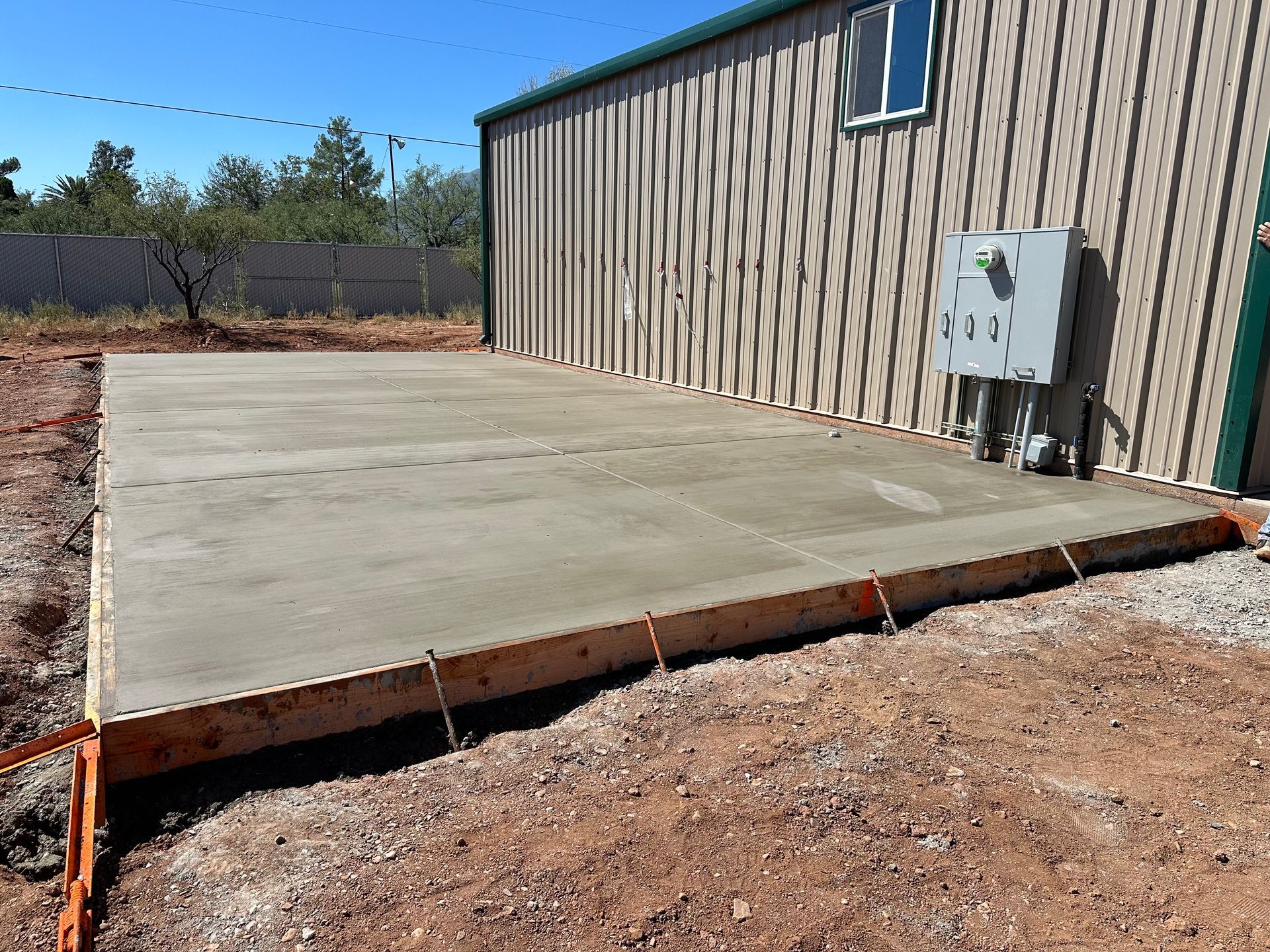 A large concrete slab is sitting in front of a building.
