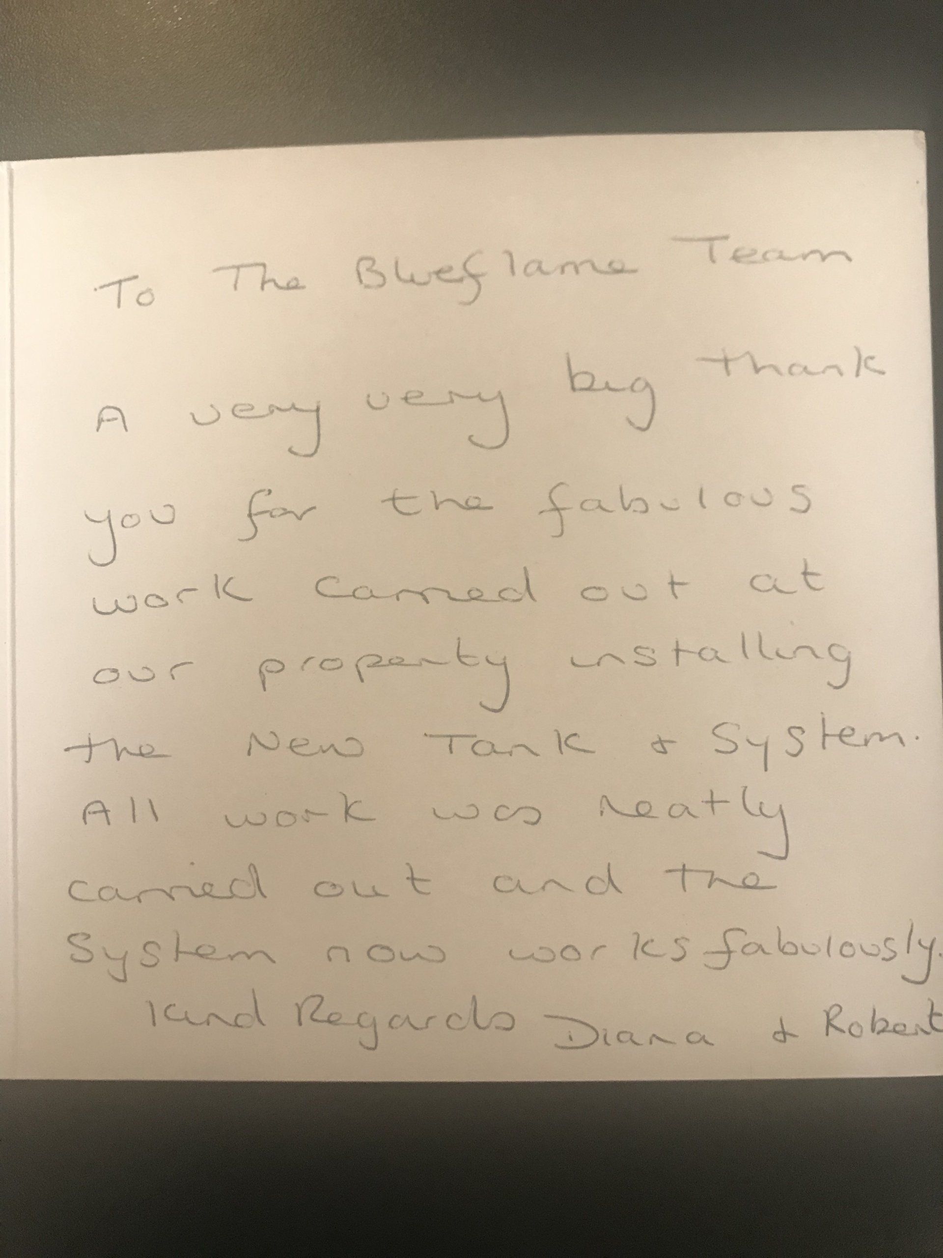 A thank you note is written on a piece of paper