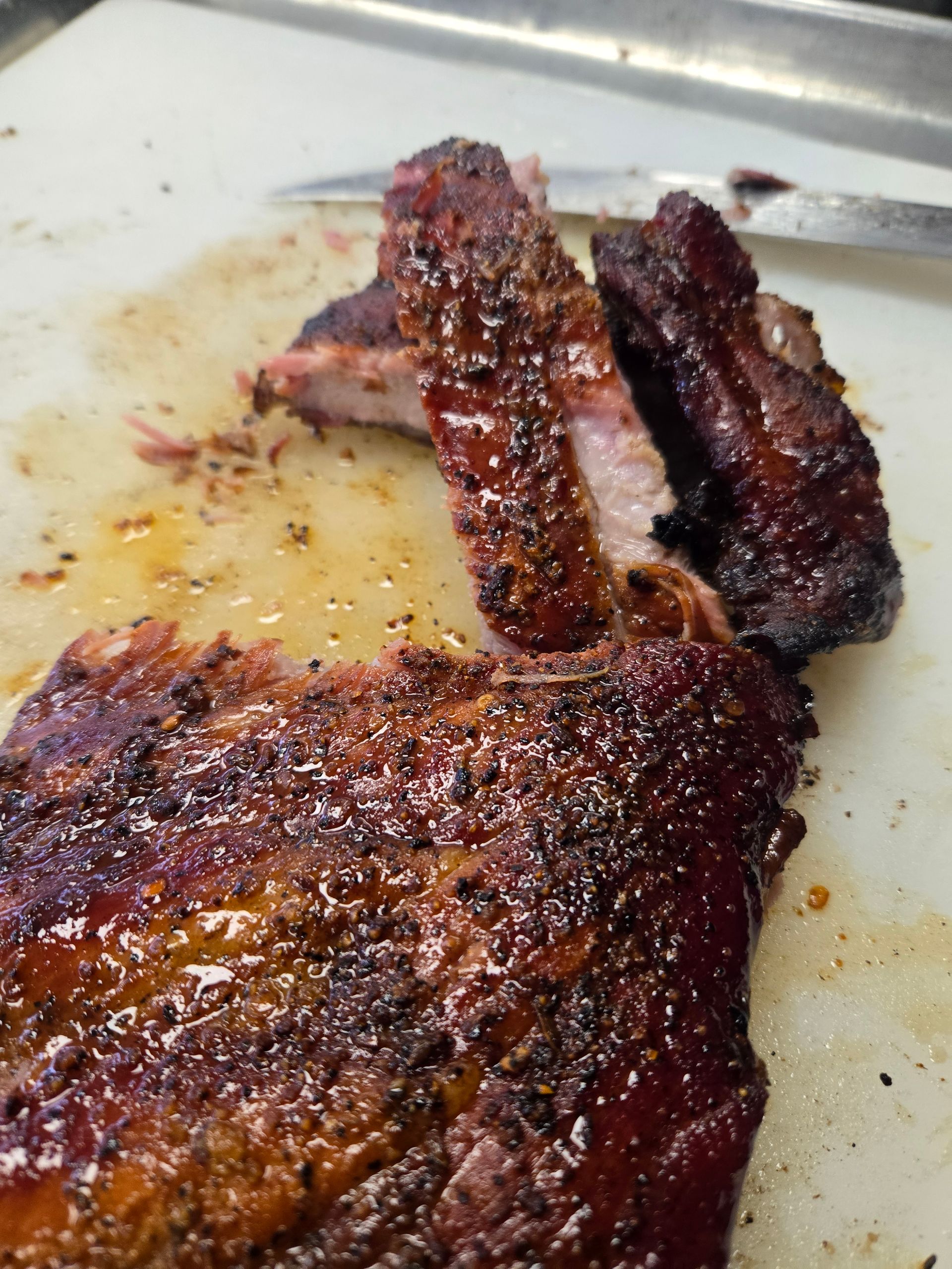 A close up of a piece of meat on a cutting board