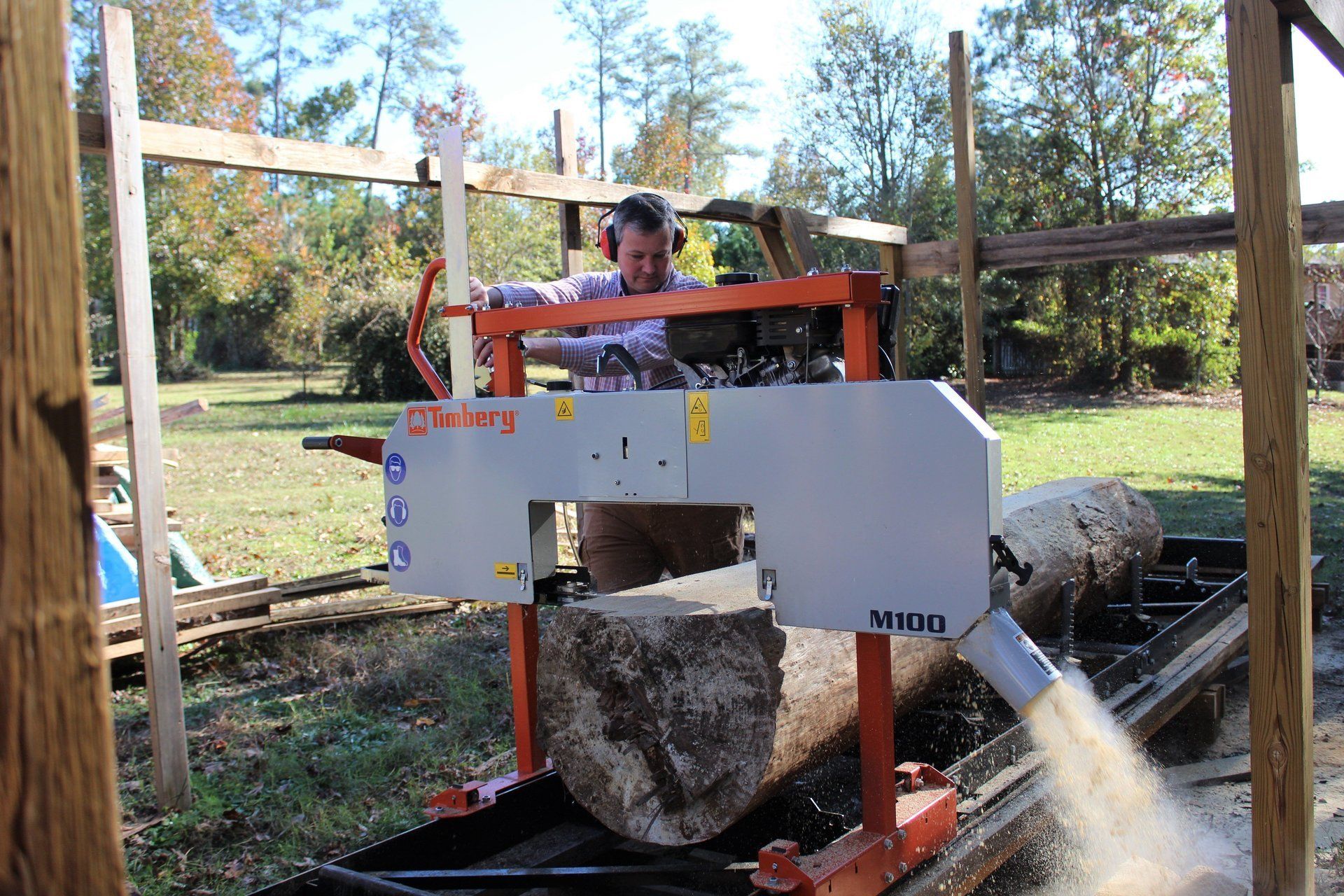 Dee Farmer sawing lumber for projects on his North Carolina hobby farm.