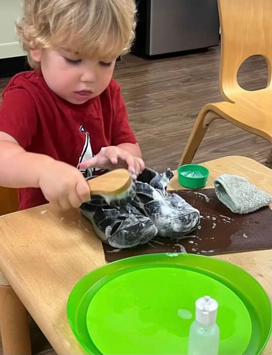 Montessori child working on practical life skills