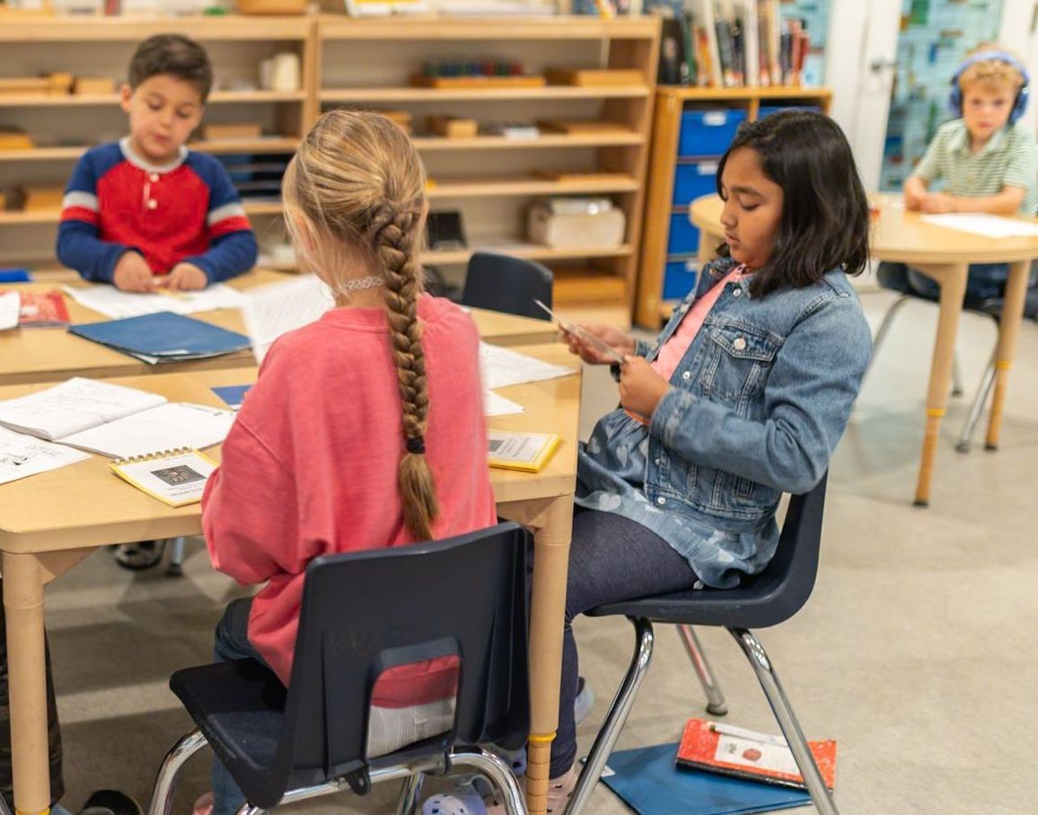 Children working together in a Montessori classroom