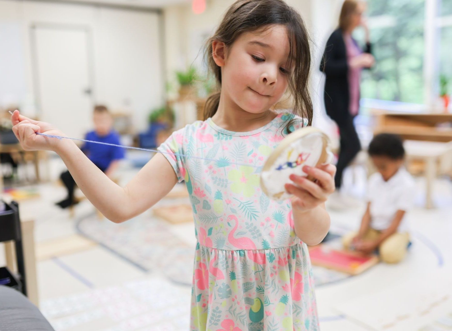 Montessori child sewing