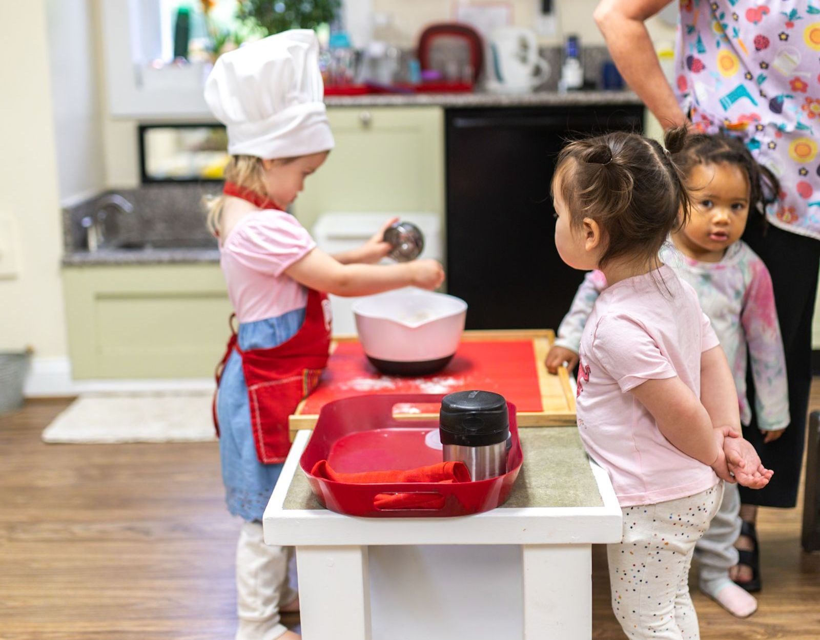 Child working with Montessori practical life materials