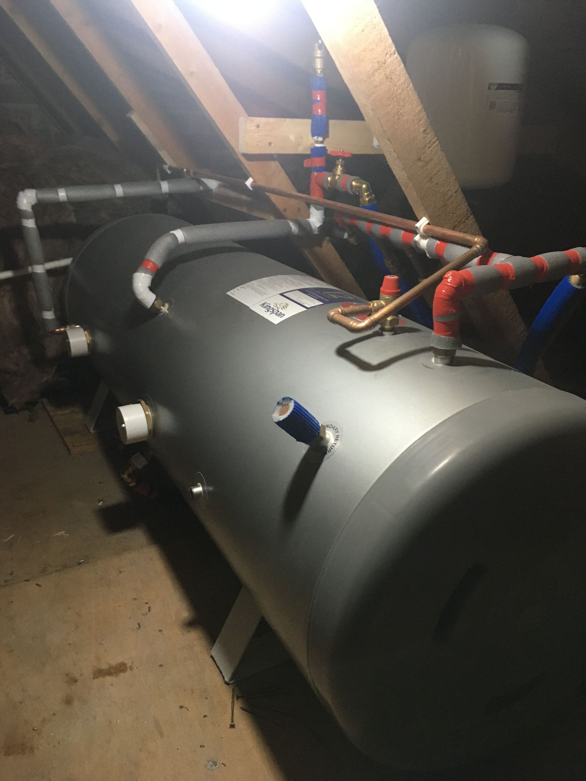 A large metal tank with pipes attached to it