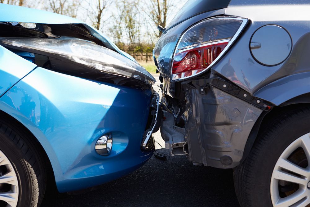 A Blue Car And A Gray Car Are Involved In A Car Accident — Old Bar Wreckers In Tuncurry, NSW