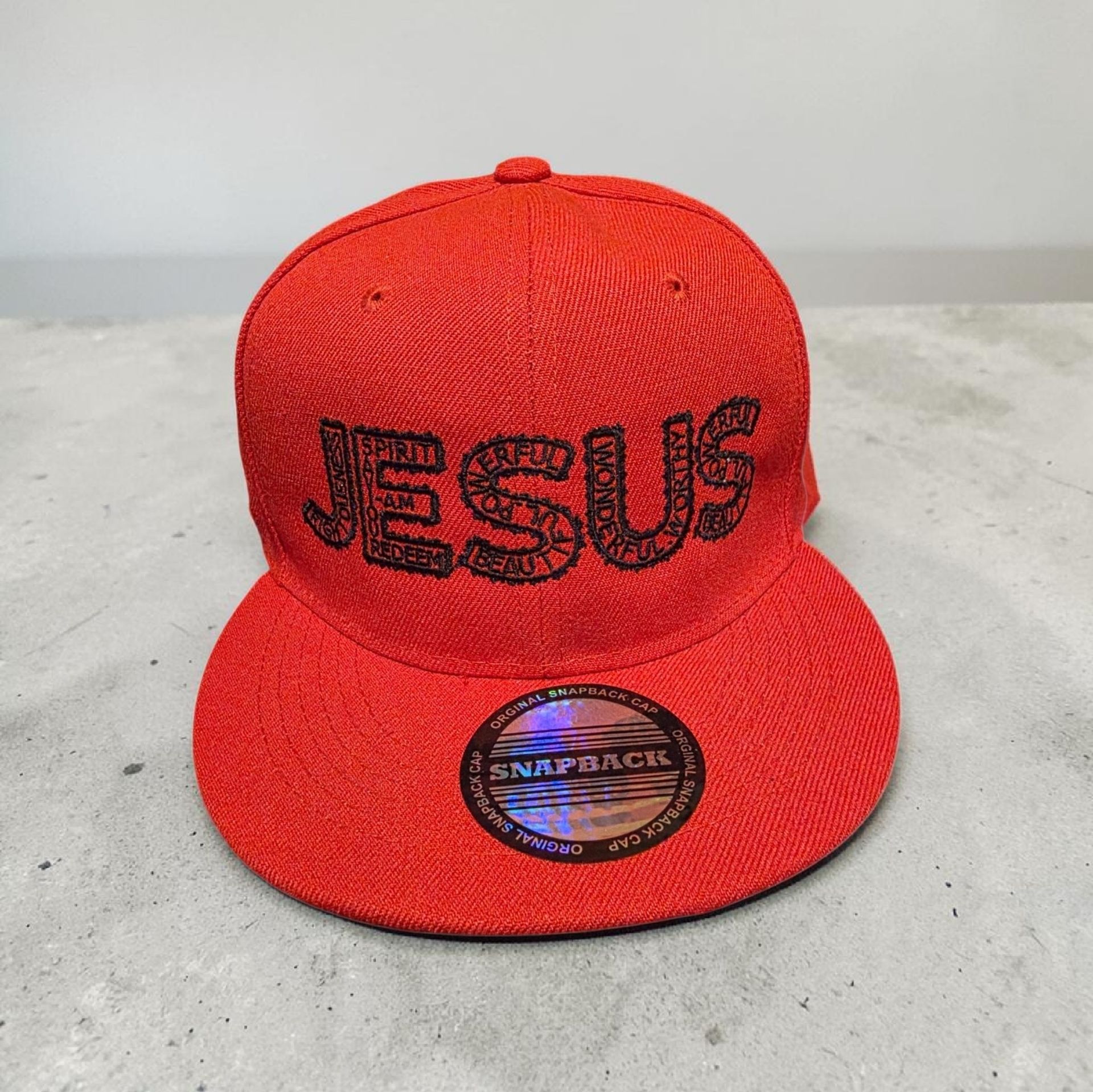 Red hat with black letters