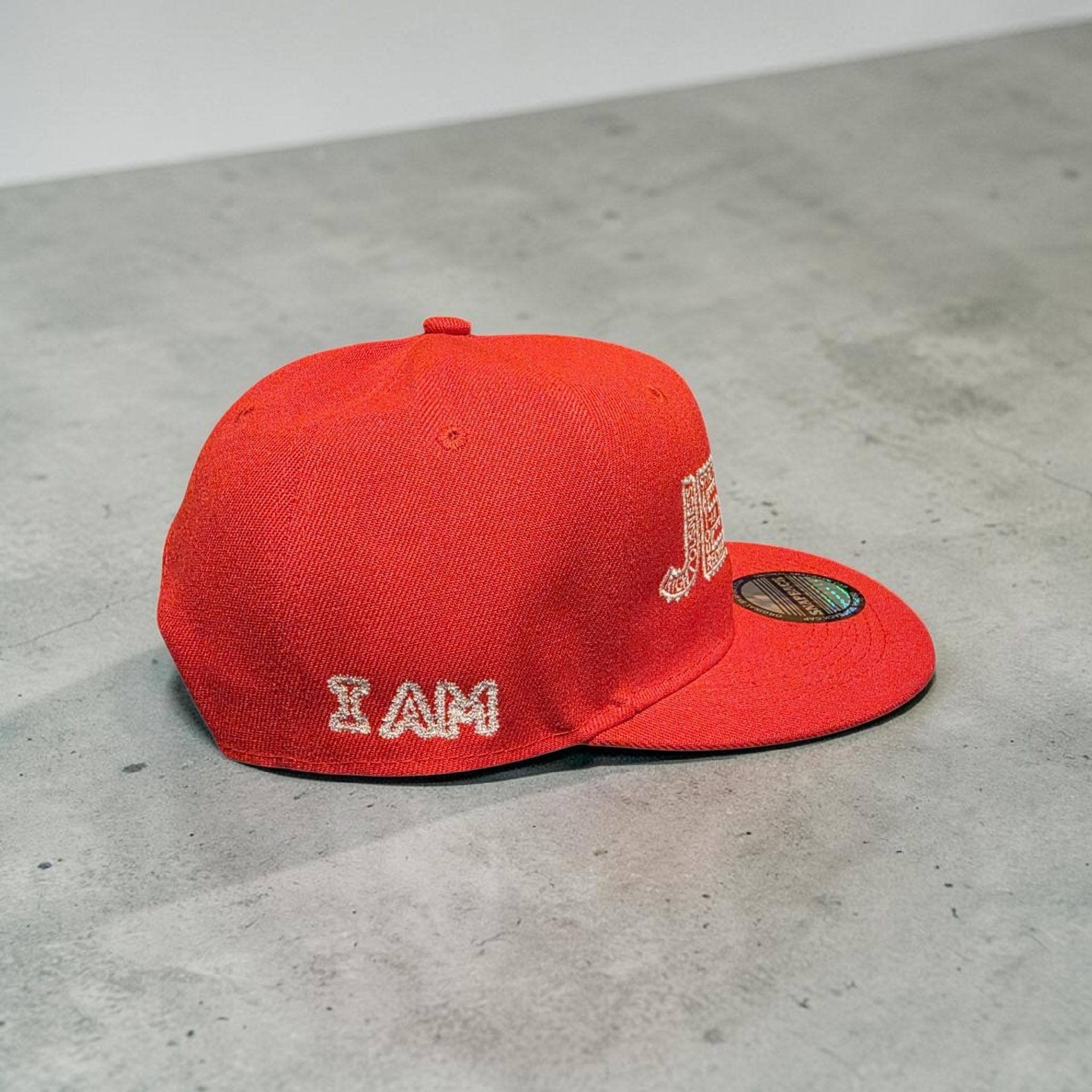 Red hat with white letters