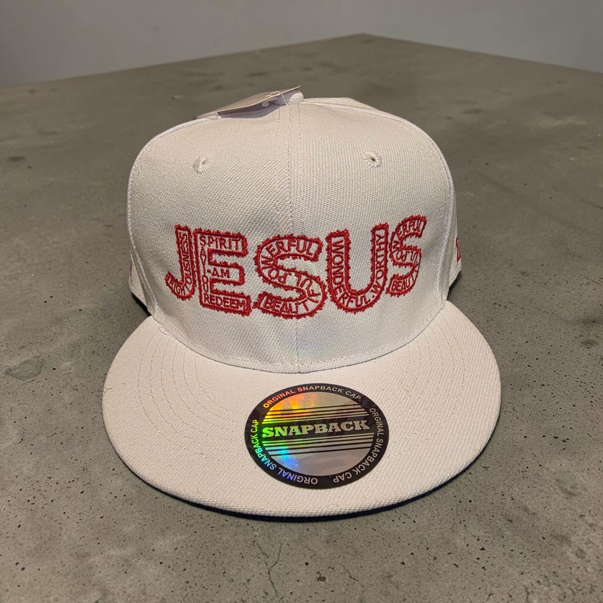 White hat with red letters