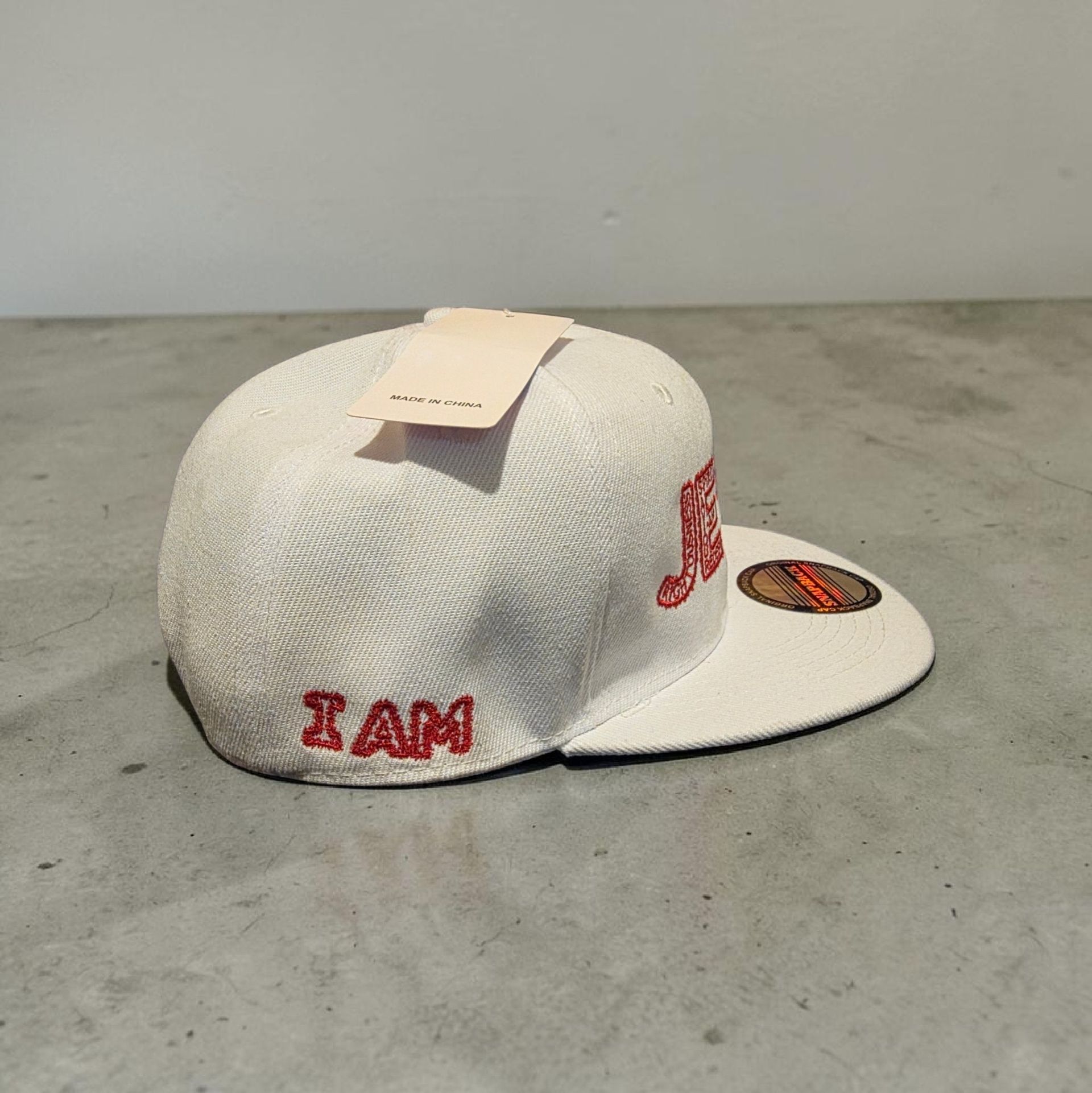 White hat with red letters