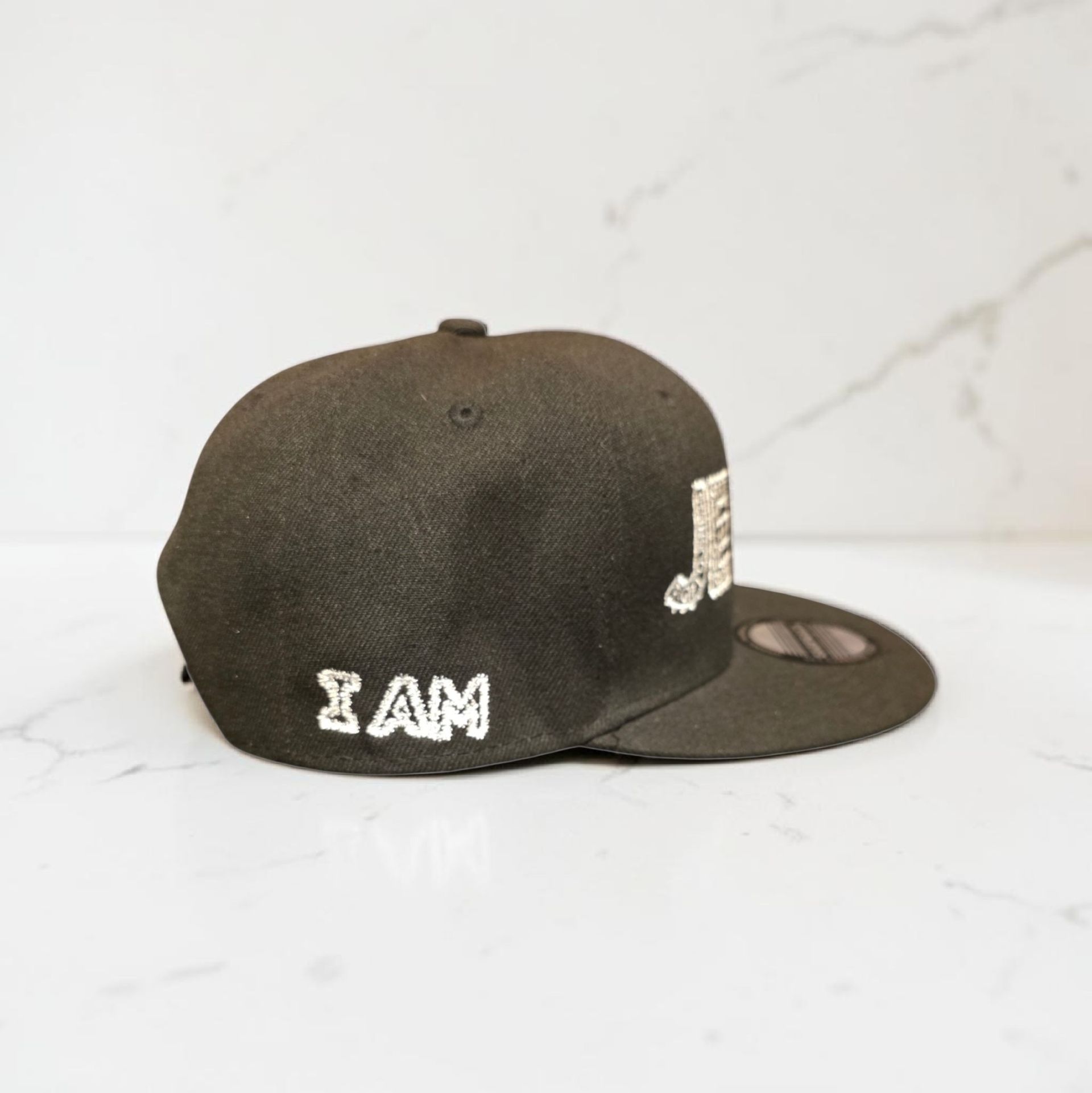 Black hat with white letters