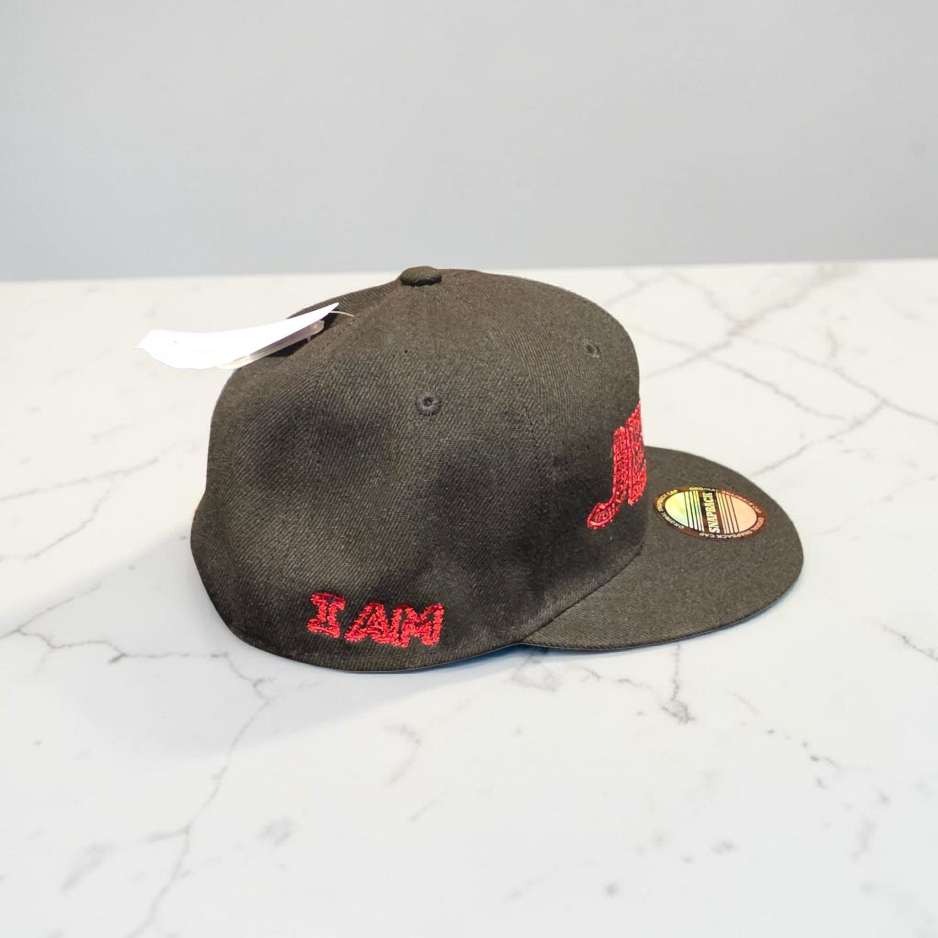 Black hat with red letters