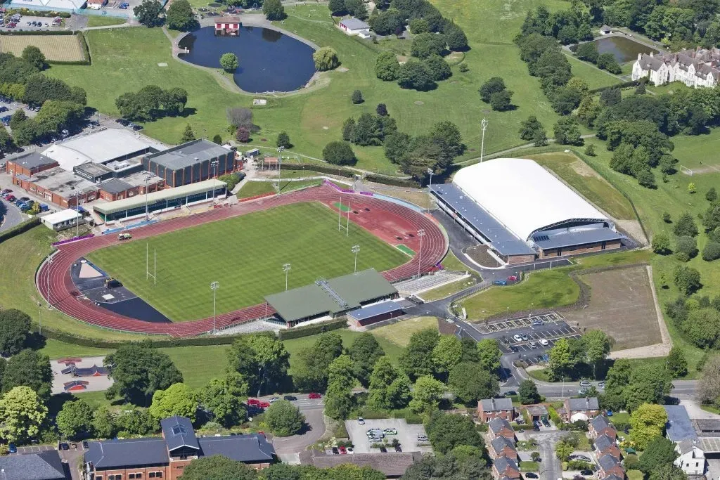 an aerial view of a soccer field and a basketball court