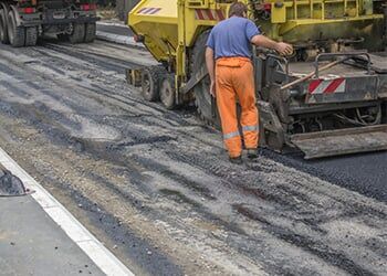 Worker and truck — Commercial Paving in Brewster, NY