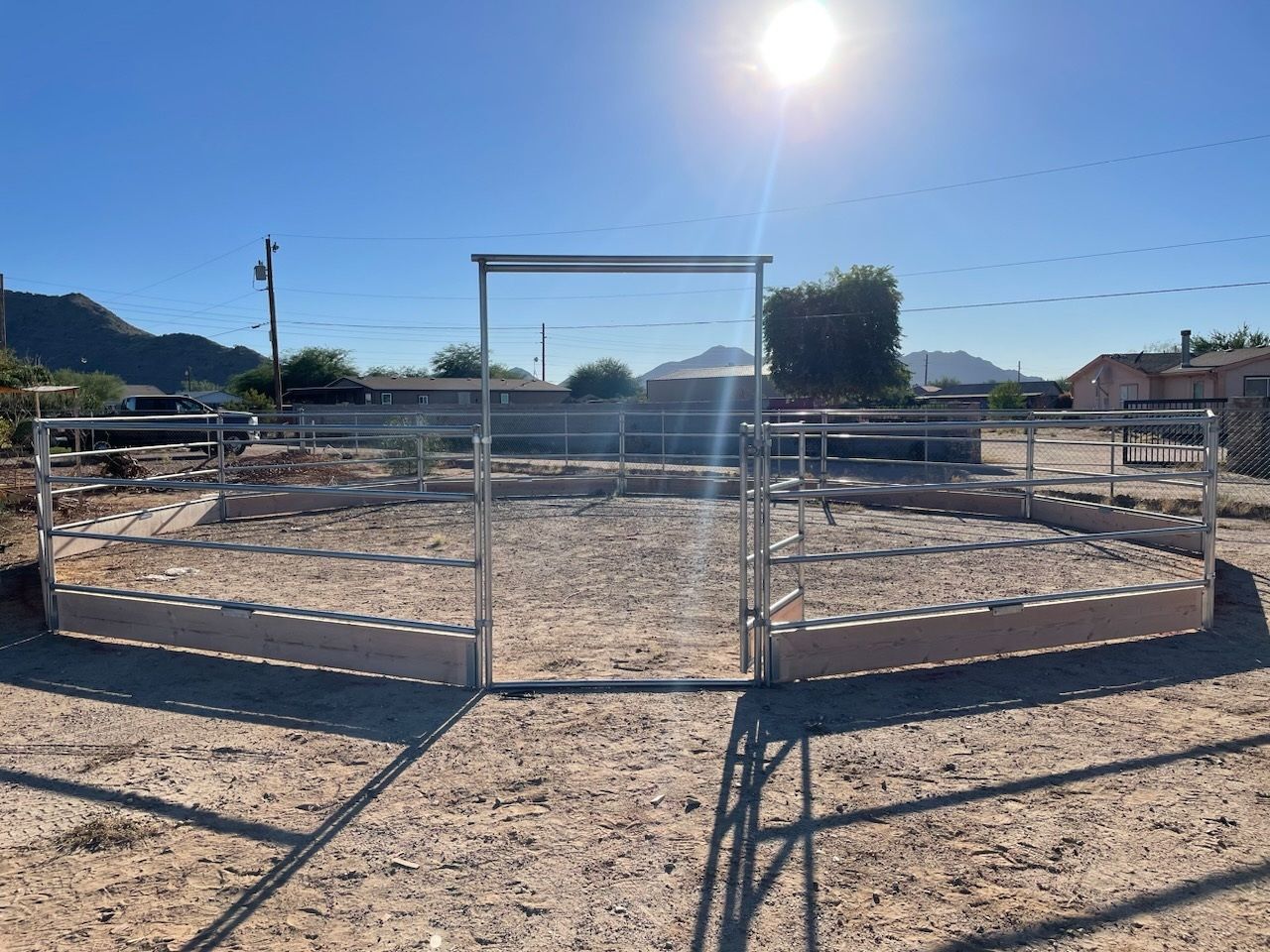 A fenced in area with a gate in the middle of it.