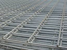 A close up of a stainless steel wire mesh fence.