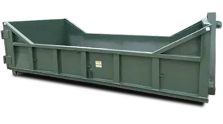 A green dumpster with a yellow trim sits in the snow