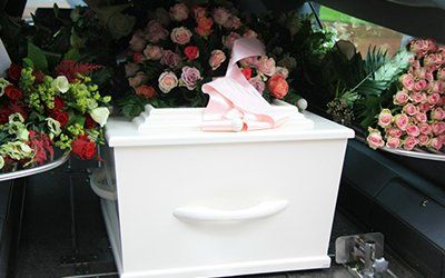 funeral cars stocked with the ceremony arrangements