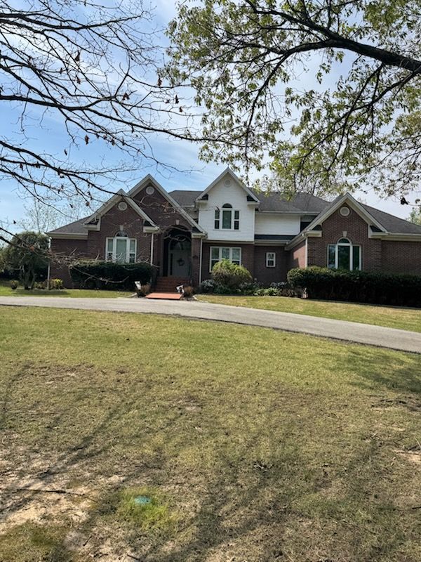 Before-and-after photos of a deck's ceiling, showing the removal of dark, dirty staining for a clean, bright finish.