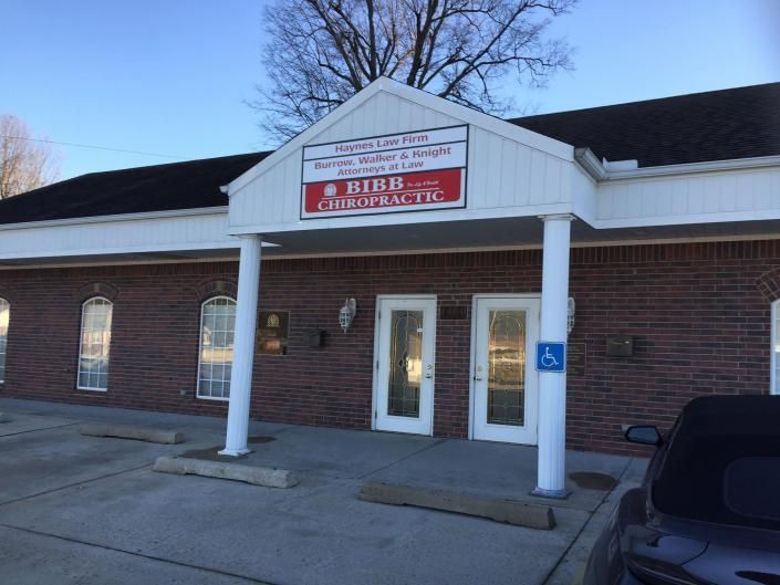 Bibb Chiropractic office building, a brick, one-story commercial structure with a front covered entrance and two doors.