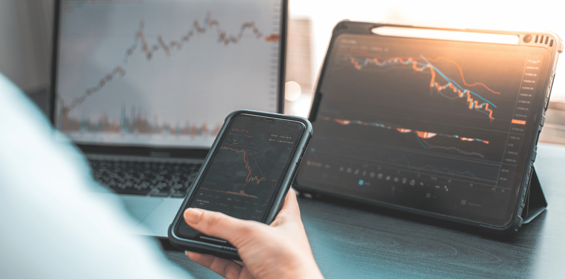 A man trading shares on a phone