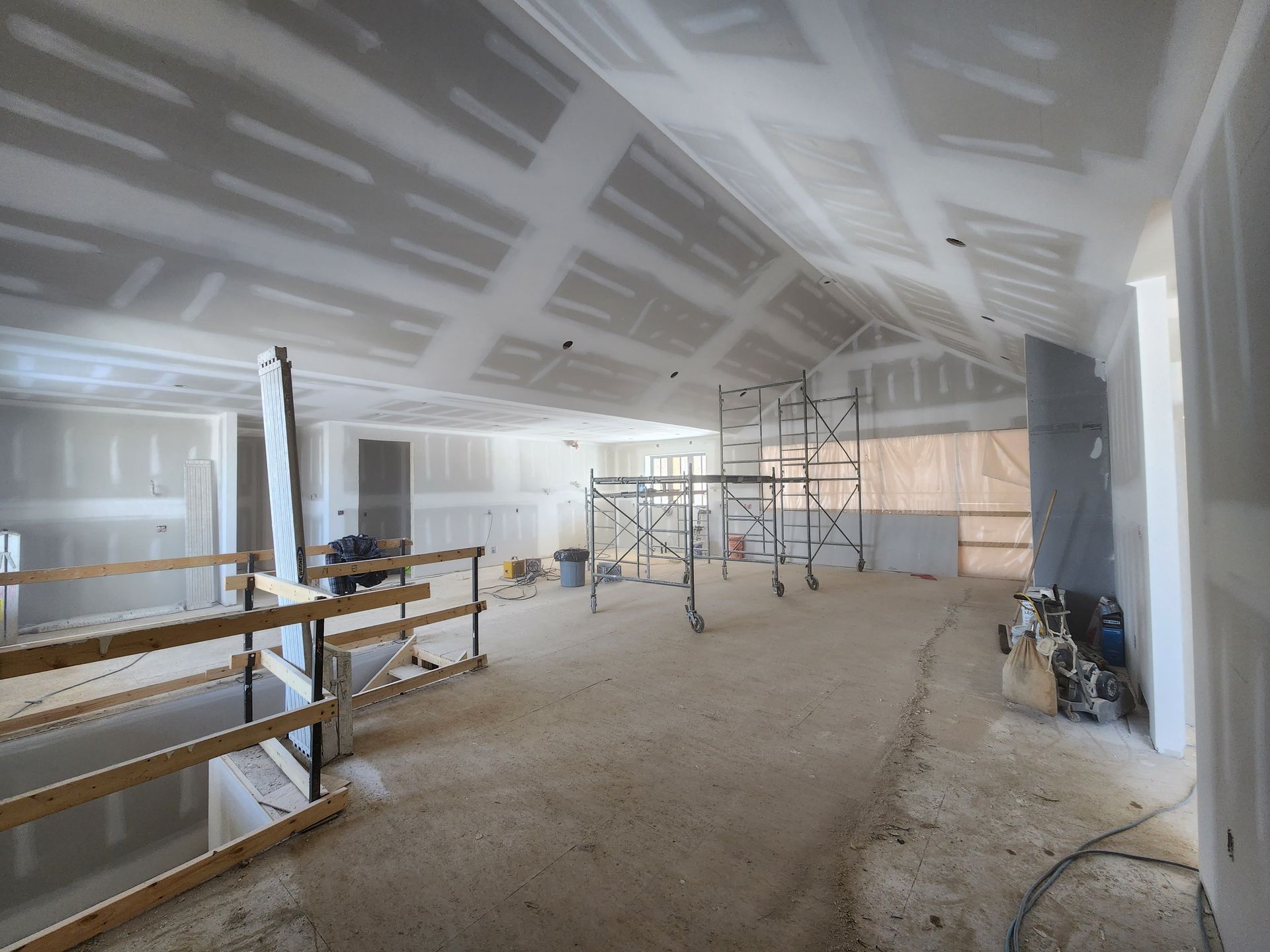 an empty room with a scaffolding in the middle of it