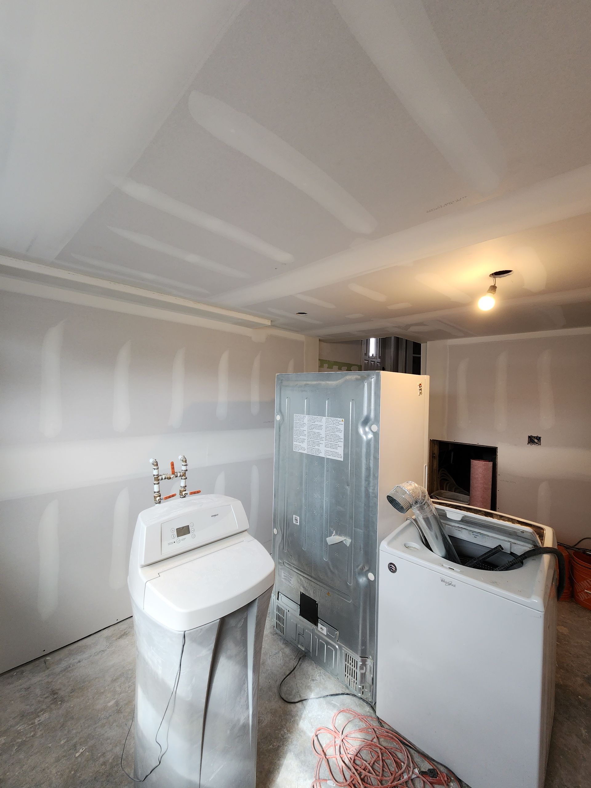 a room with a washer and dryer in it