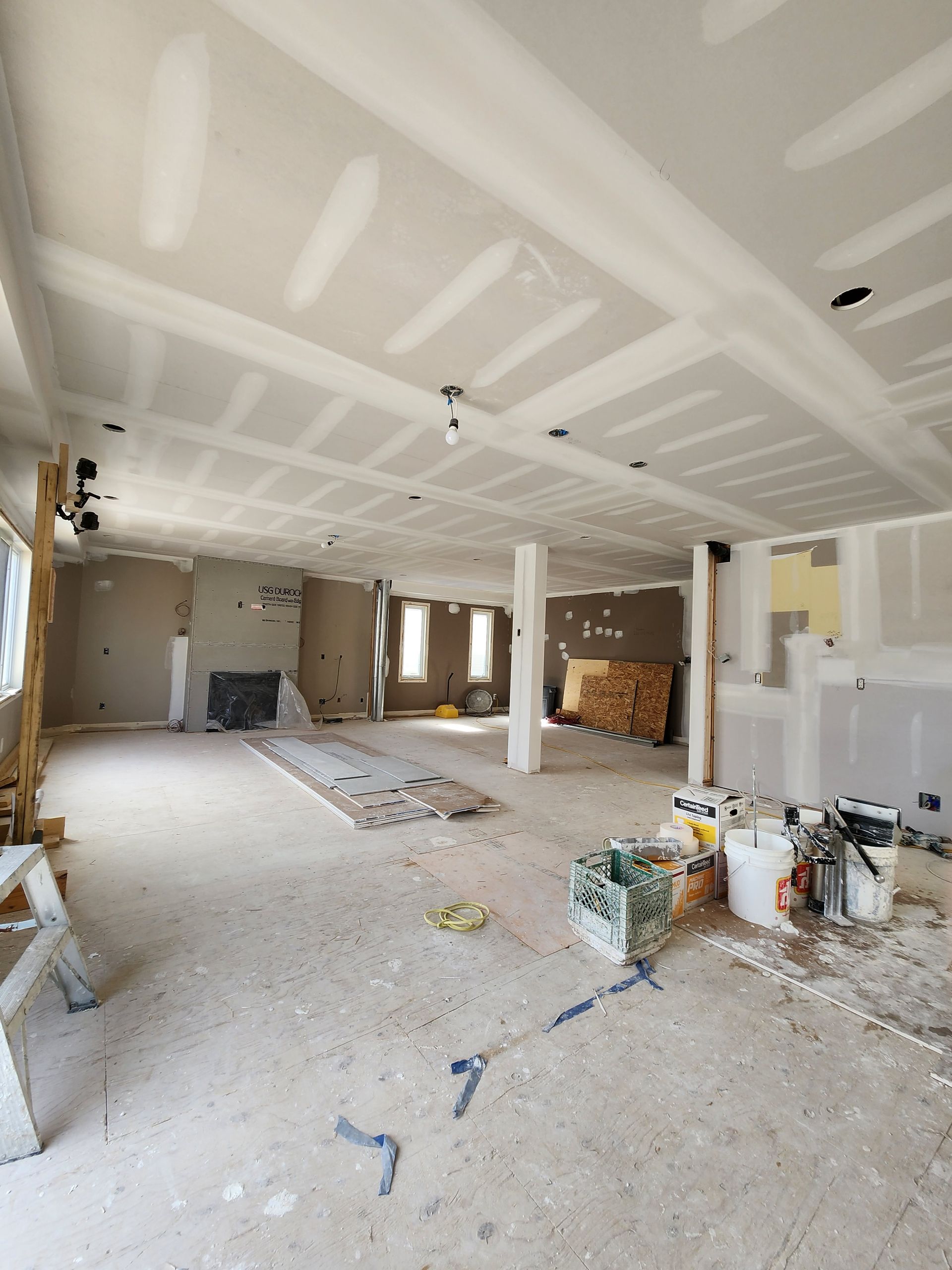 a large room with a ceiling that is being remodeled