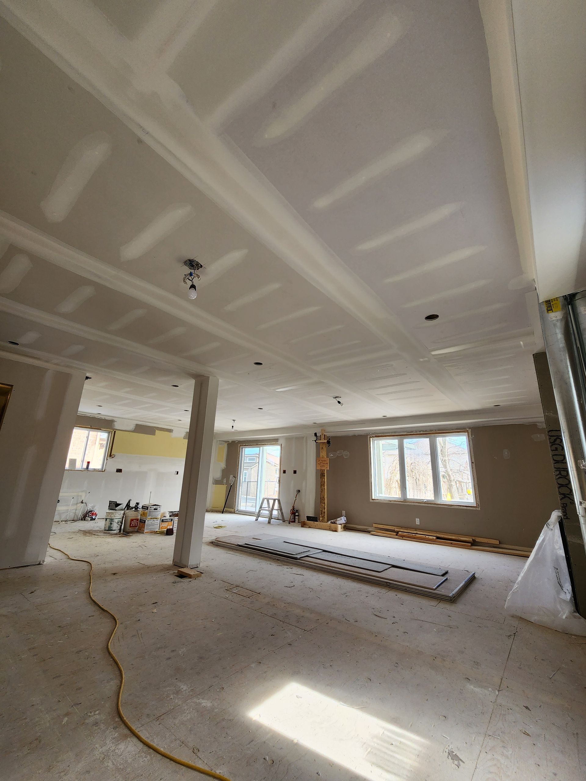 a large room with a ceiling that is being remodeled .