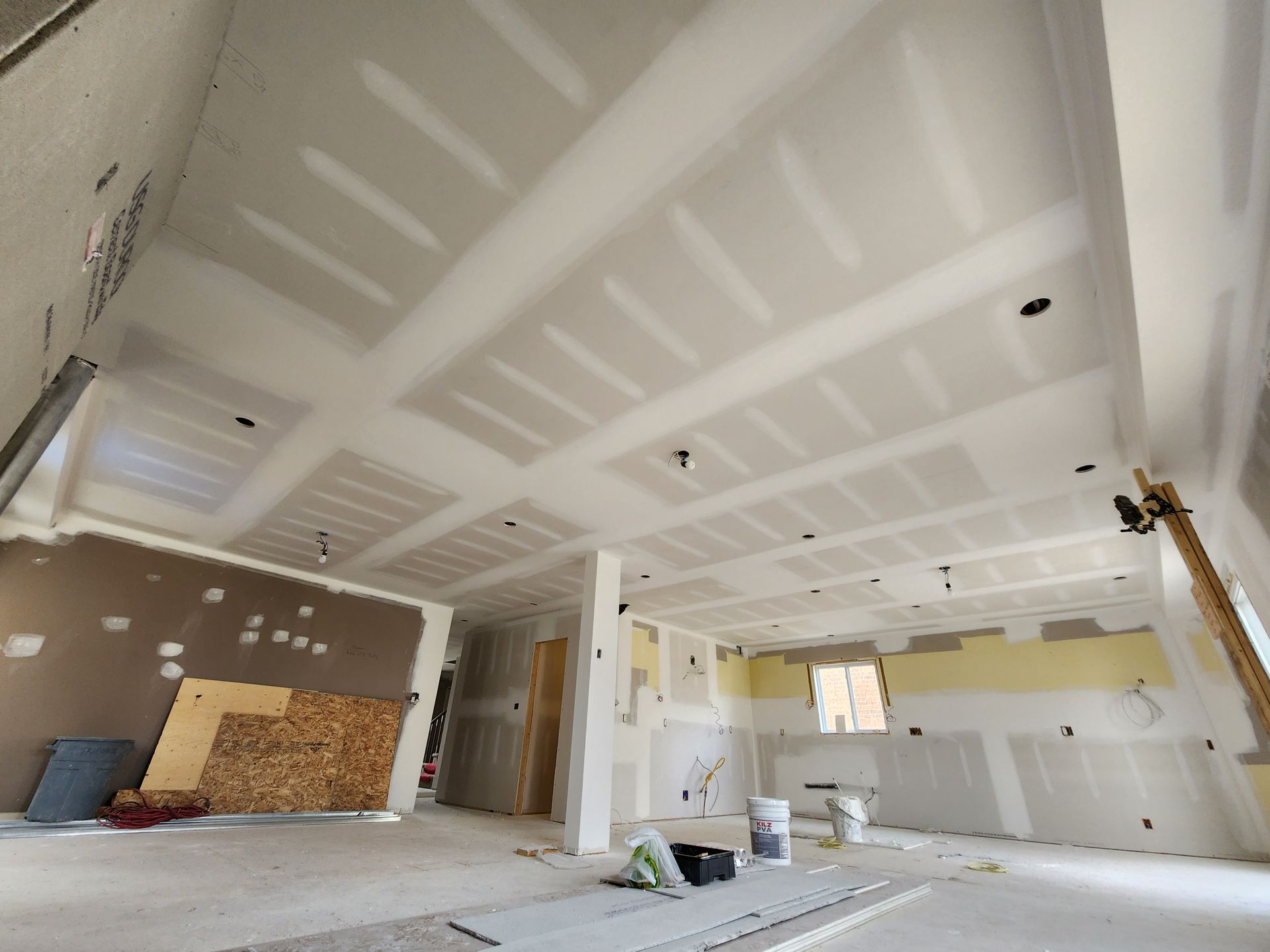 a room that is being remodeled with drywall on the ceiling