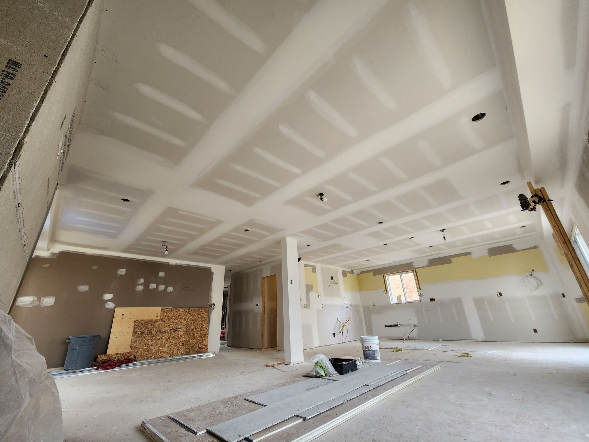 a large room with a lot of drywall on the ceiling