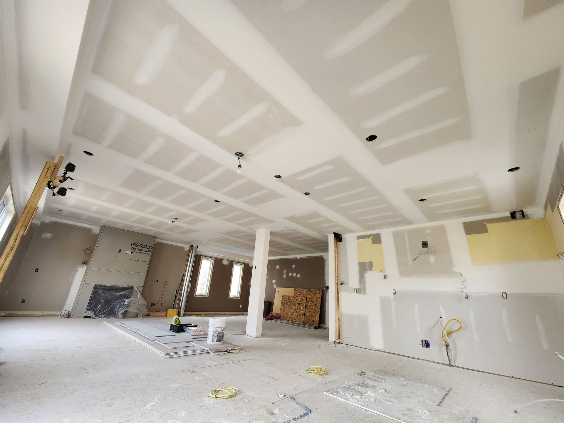 a room that is being remodeled with drywall on the ceiling