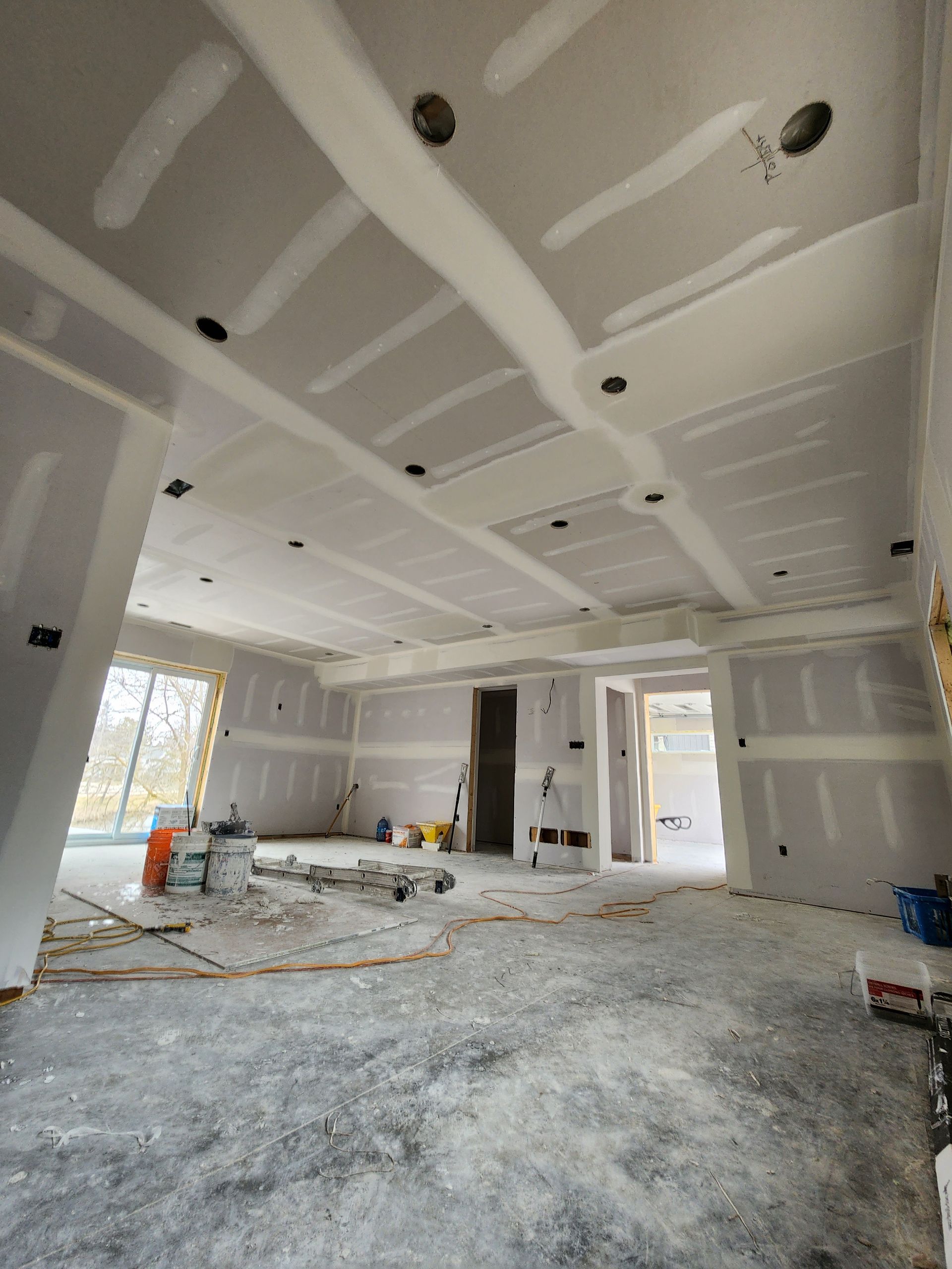a large room with a lot of drywall on the walls and ceiling .