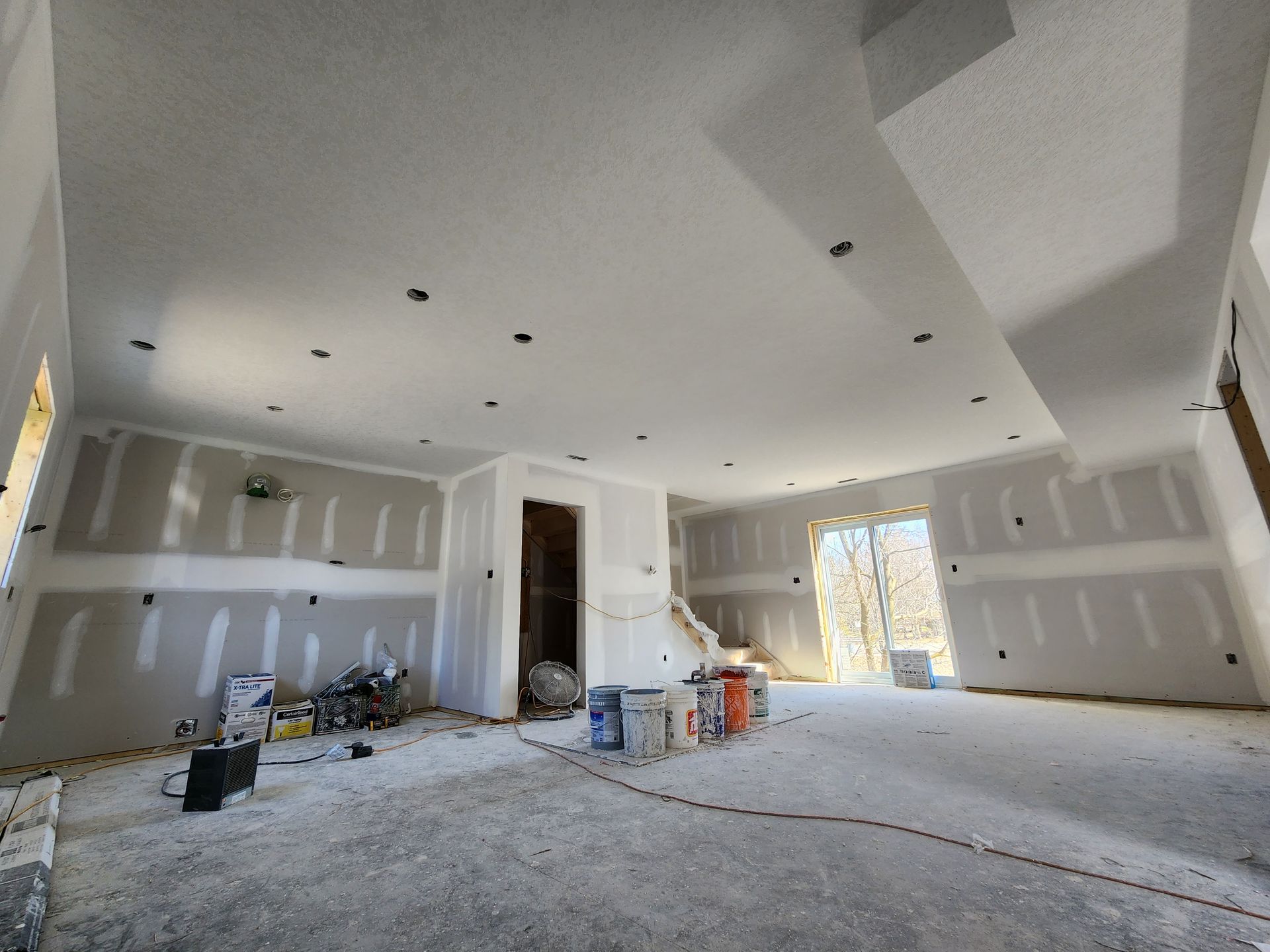 a room that is being remodeled with drywall on the walls