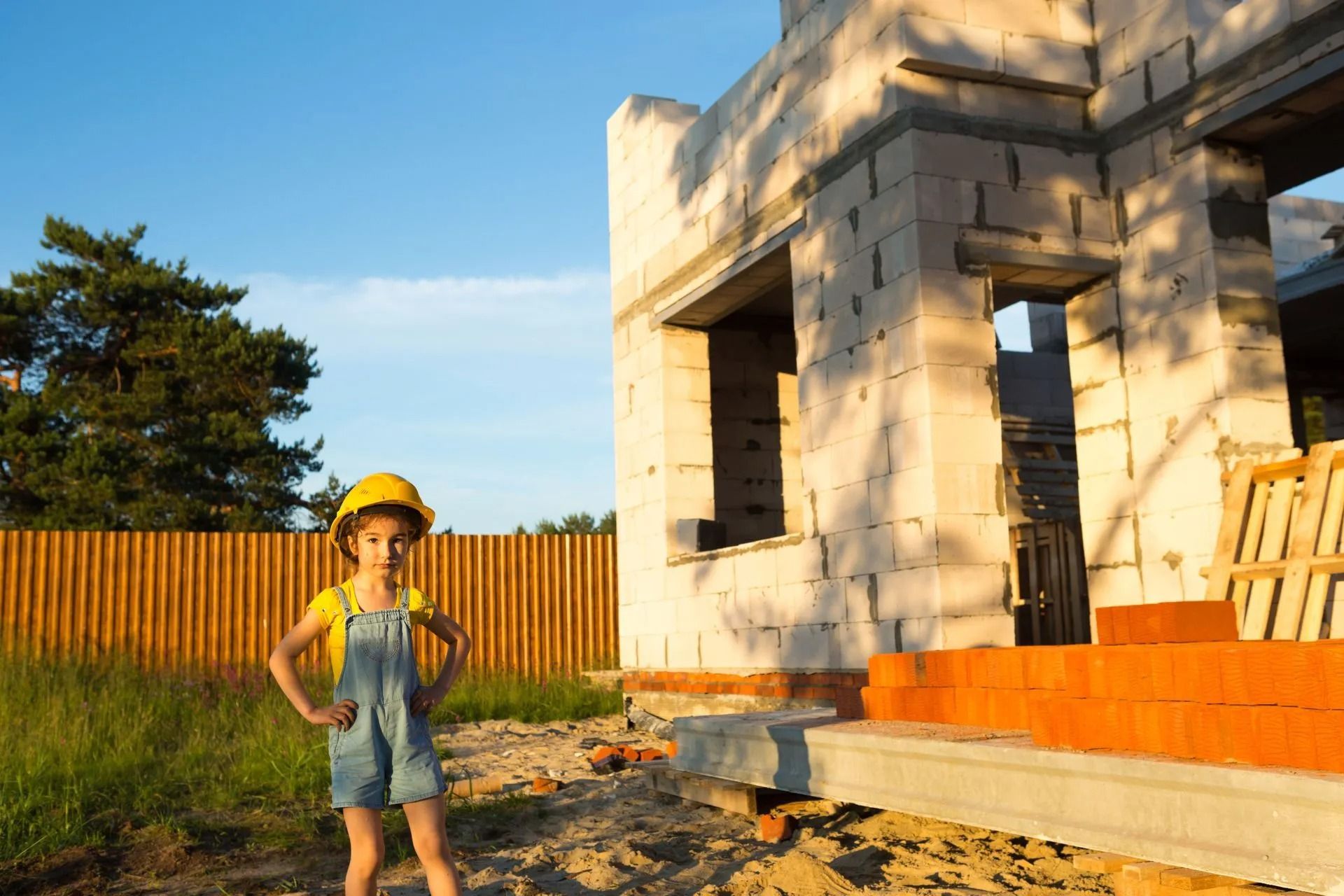 A doctor is sitting at a table talking to two elderly people.
