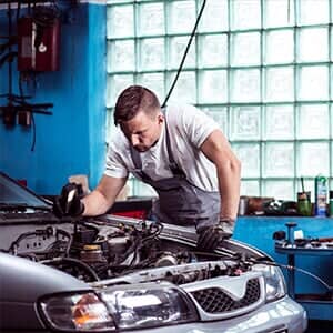 Car mechanic at work - Engine Maintenance and Repair in Austin,MN