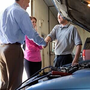 Couple Shaking Hands with Auto Mechanic  - Car Repair and Service in Austin, MN