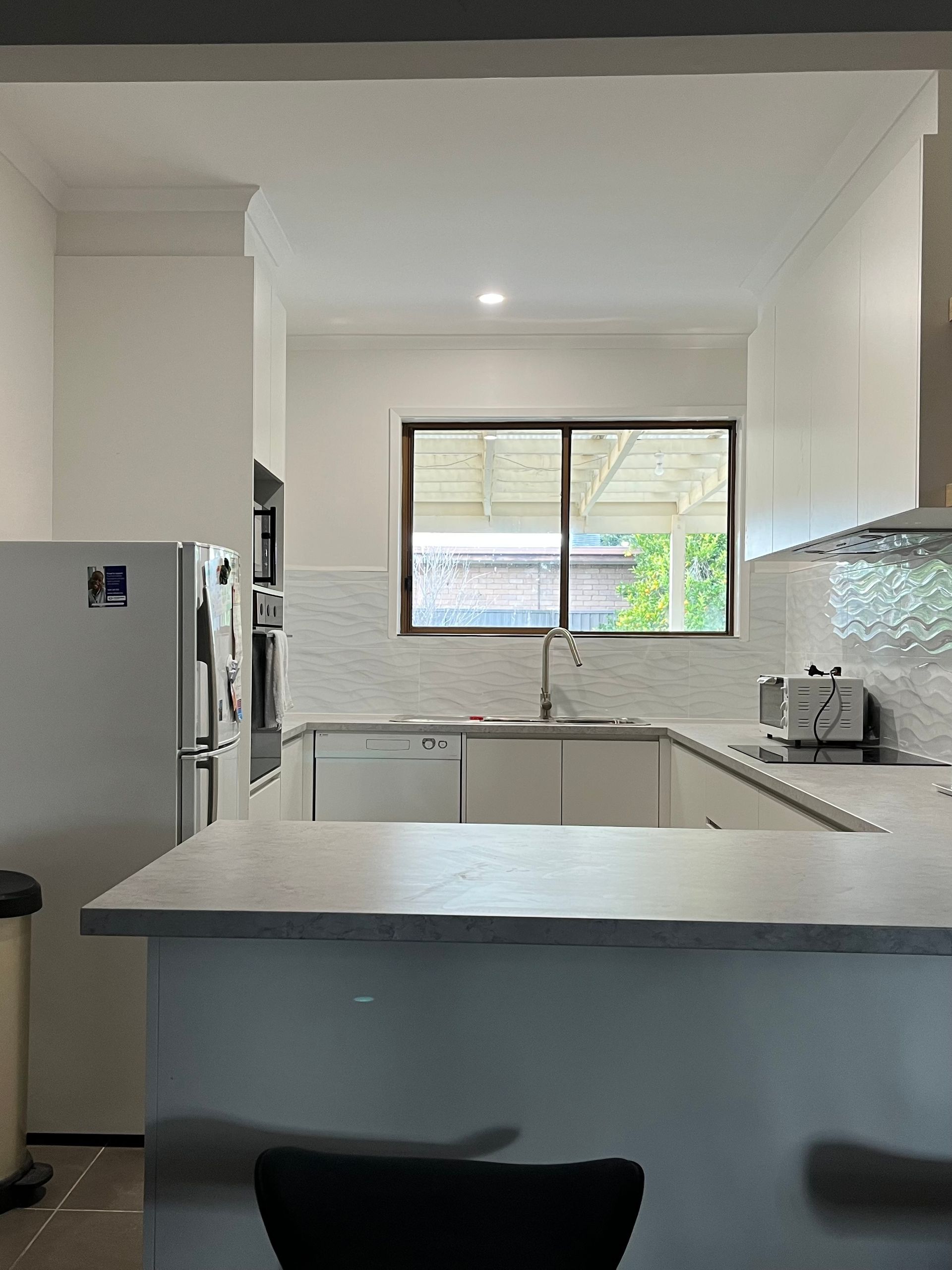 White Kitchen With Window, Countertop, Appliances — GV painting in Shepparton, VIC