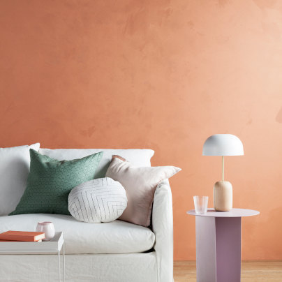 White Couch With Green and Pink Pillows in Front of a Peach Wall — GV painting in Shepparton, VIC