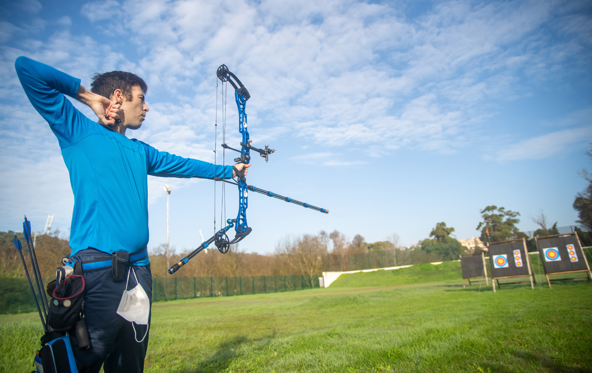 a man shooting with archer