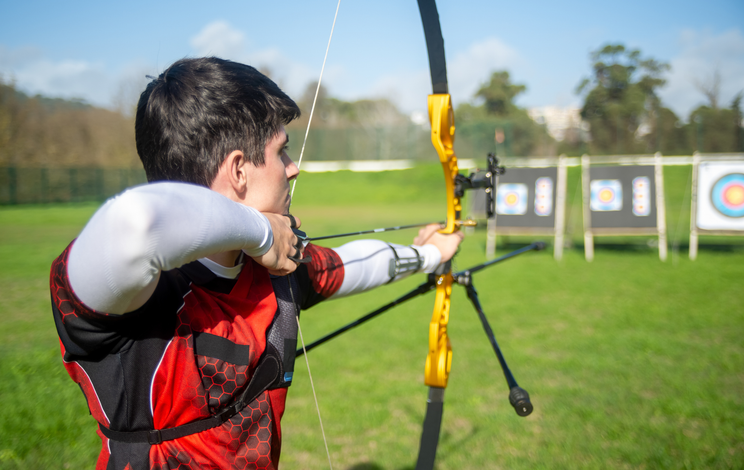 a man shooting with archer
