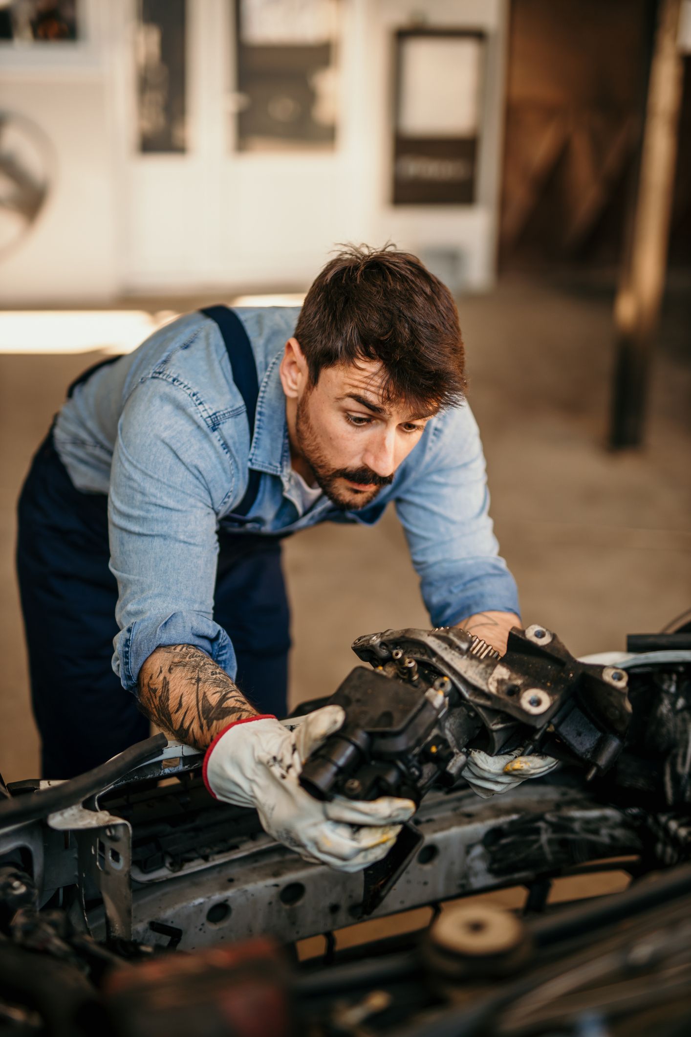 A Man is Working on a Car Engine — Smyrna, GA — All Pro Transmission
