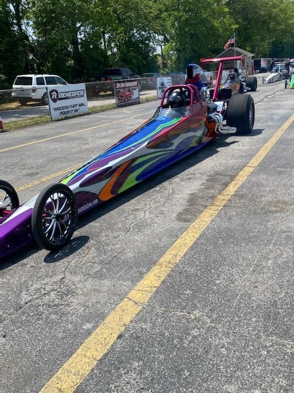 A Colorful Dragster is Parked in a Parking lot Next to a Renegade Racing Sign — Smyrna, GA — All Pro Transmission