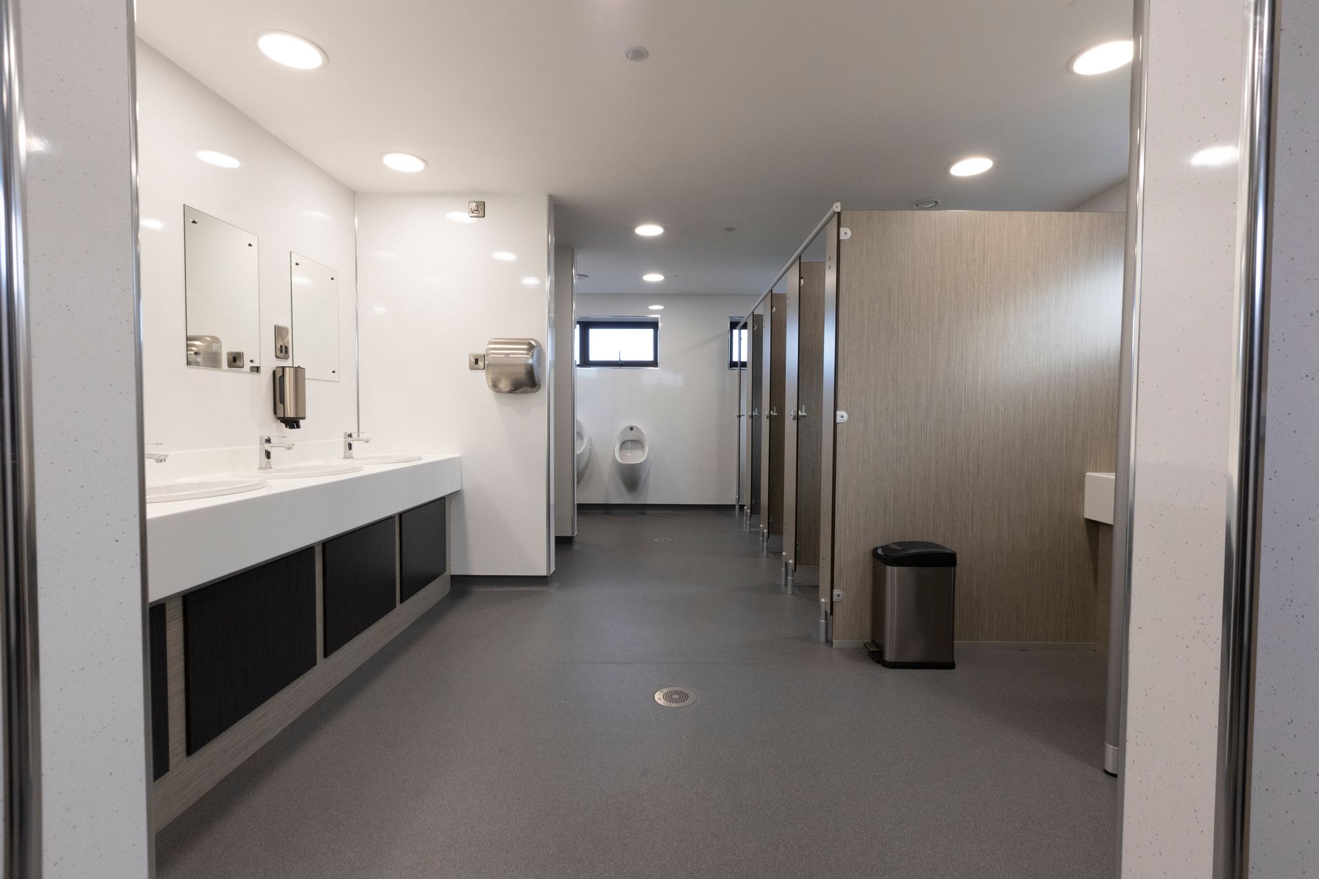 A sunset over a body of water with houses in the foreground.