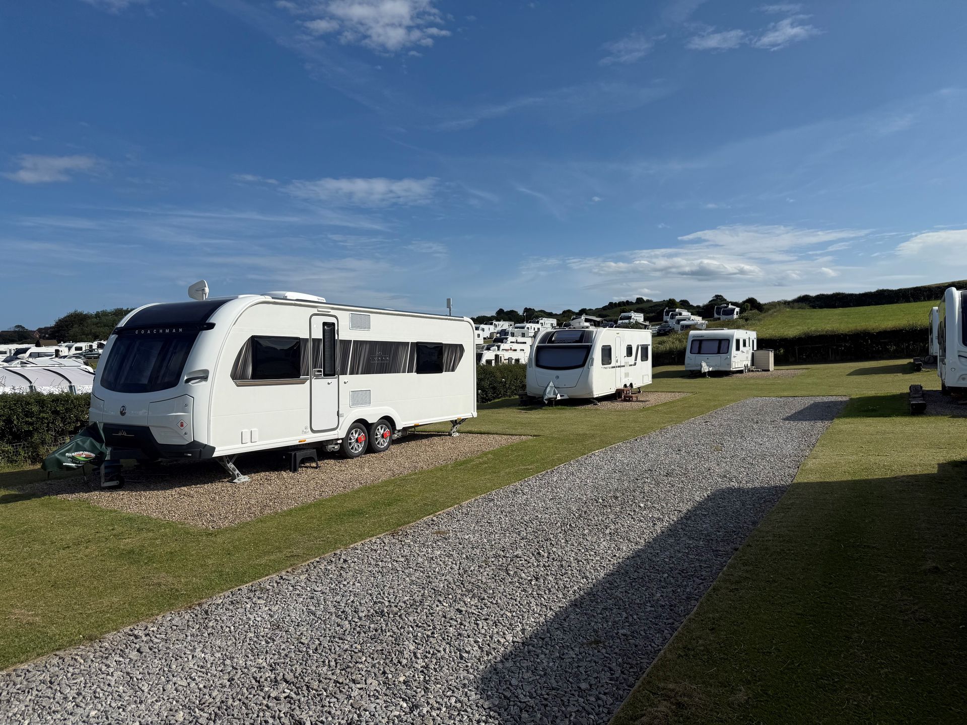 There is a house on the cliff overlooking the ocean.