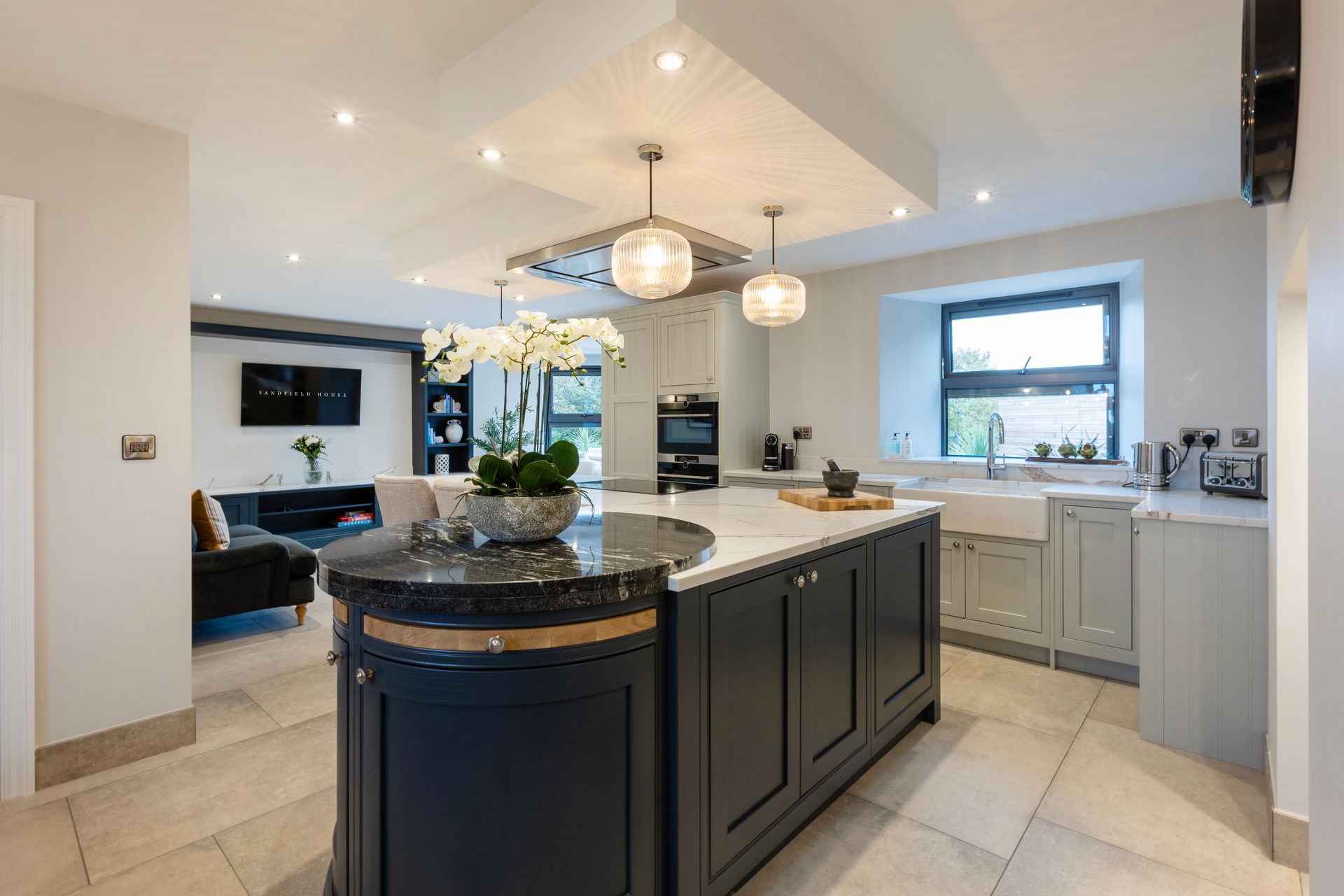 There is a large island in the middle of the kitchen.