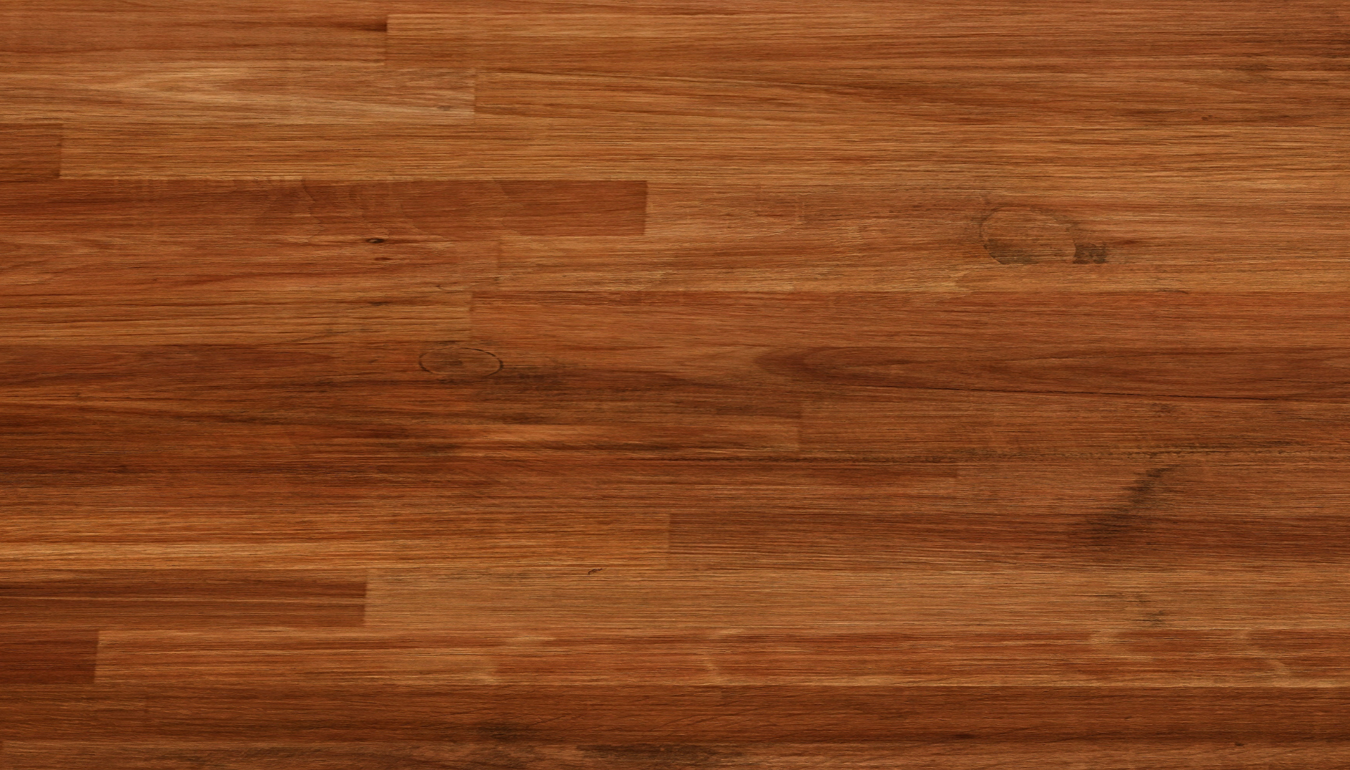 A close up of a wooden floor with a grain and texture.