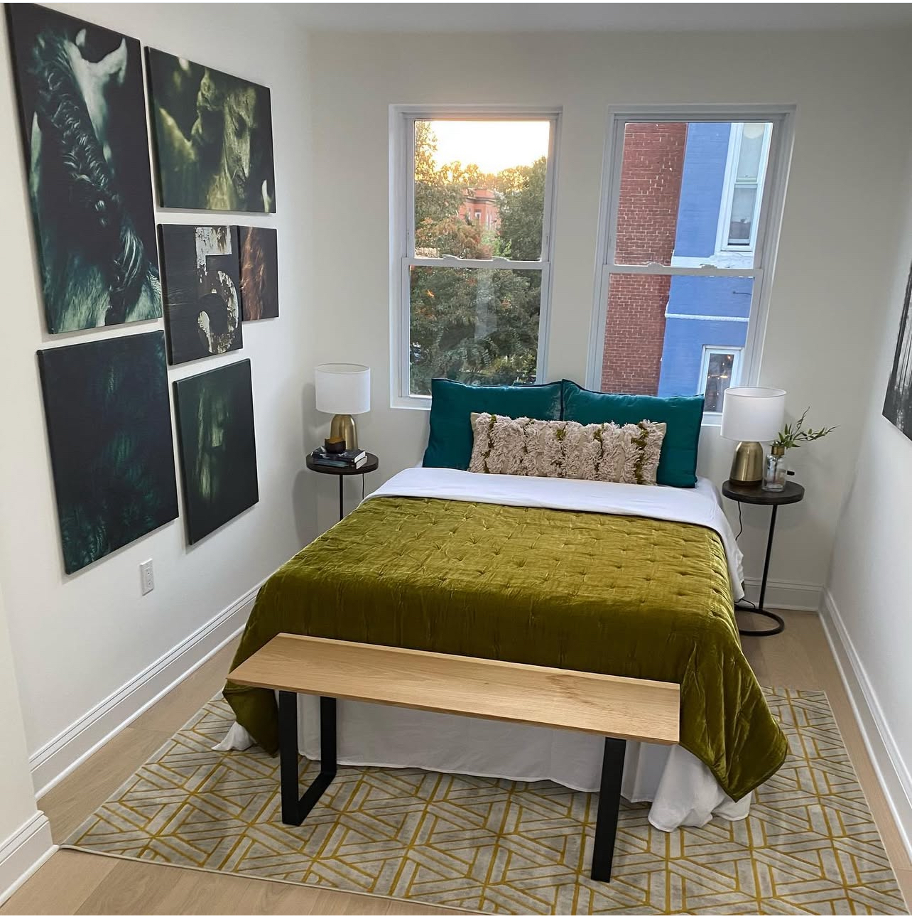 A bedroom with a bed and a bench in it