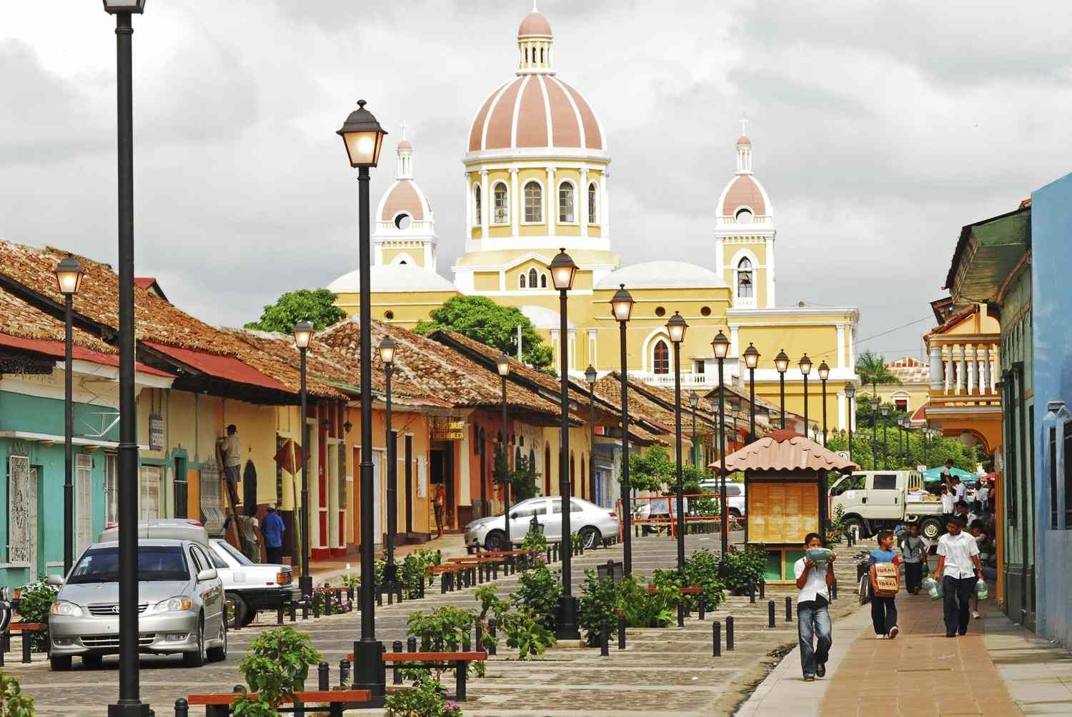 A city street with a church in the background